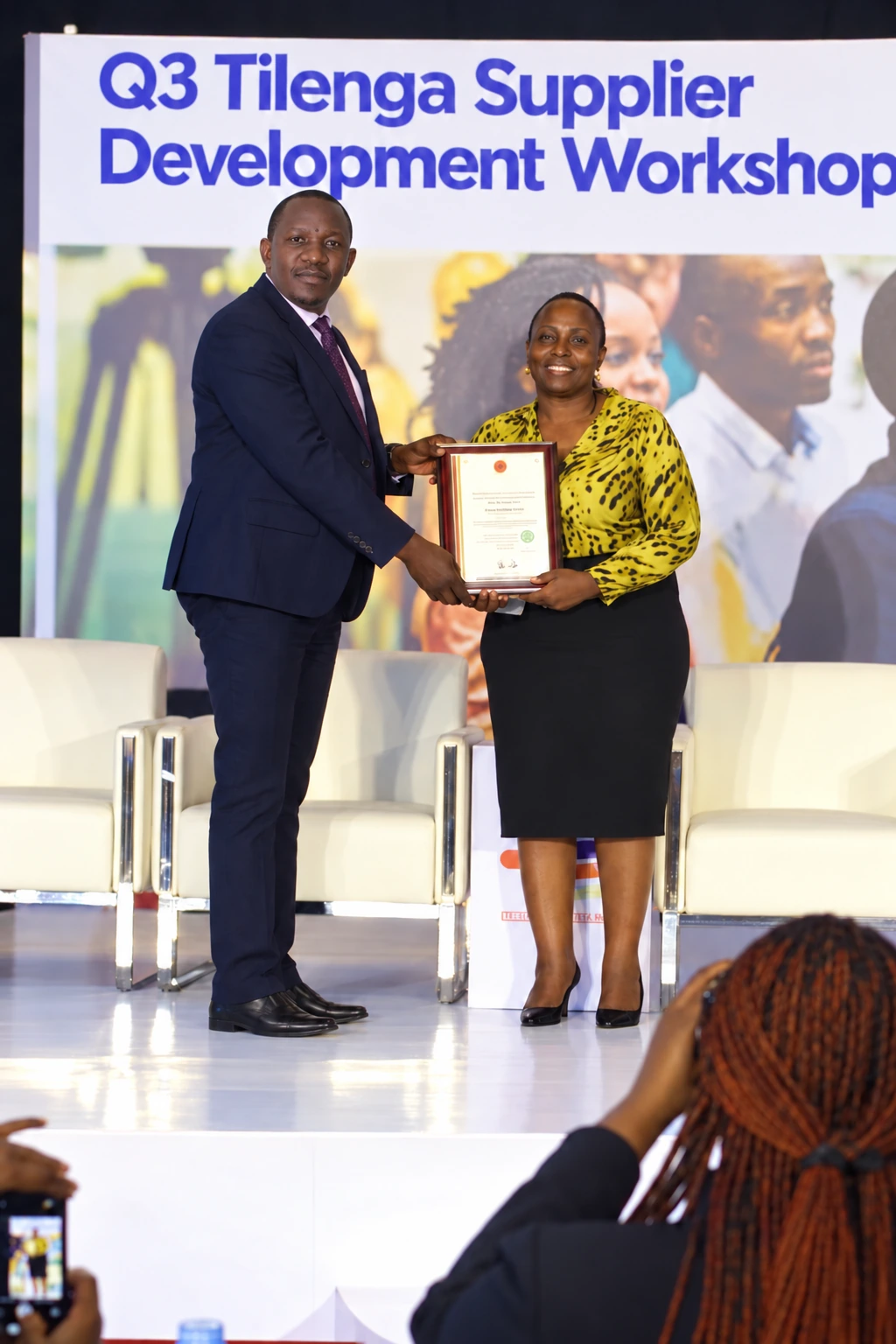 Managing Director Crispus Omuut receiving the award at the Q3 Tilenga Supplier Development Workshop